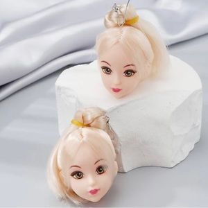 Doll head earrings